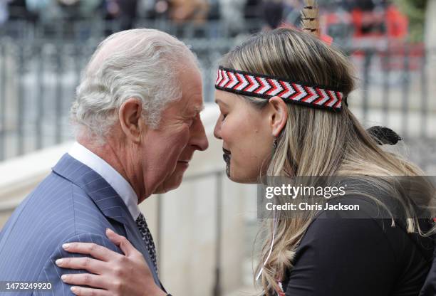 King Charles III uses the 'Hongi', a traditional Maori greeting of touching noses as he attends the 2023 Commonwealth Day Service at Westminster...