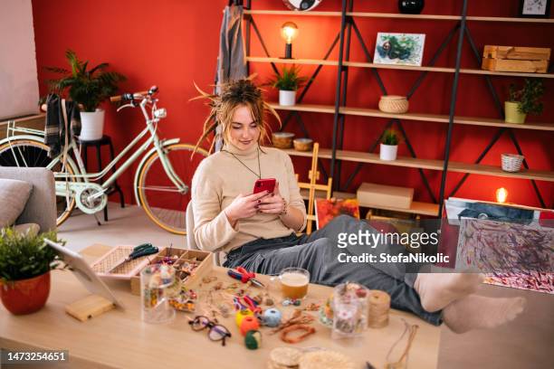 woman is texting on her smartphone - diy beauty stock pictures, royalty-free photos & images
