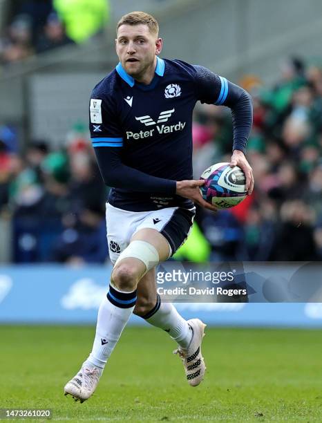 Finn Russell of Scotland runs with the ball during the Six Nations Rugby match between Scotland and Ireland at Murrayfield Stadium on March 12, 2023...
