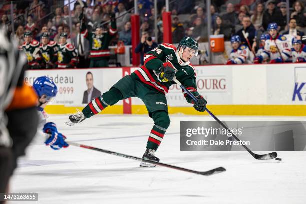 Alexandre Doucet of Halifax Mooseheads shoot puck into empty net during third period at Avenir Centre on March 12, 2023 in Moncton, Canada.