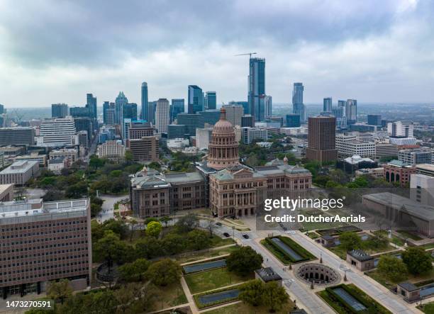 aerial view of state capitol building in downtown austin, texas - austin texas aerial stock pictures, royalty-free photos & images