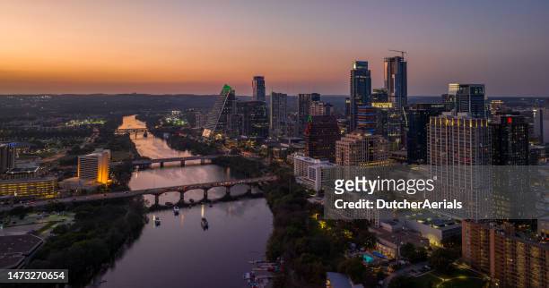 beautiful aerial view of downtown austin, texas and colorado river at sunset - skyline dusk stock pictures, royalty-free photos & images