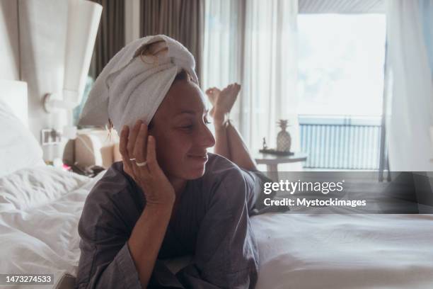 Resting Woman Robe 132 Woman In Robe At Beach Resort Stock Photos, High-Res Pictures, and ...