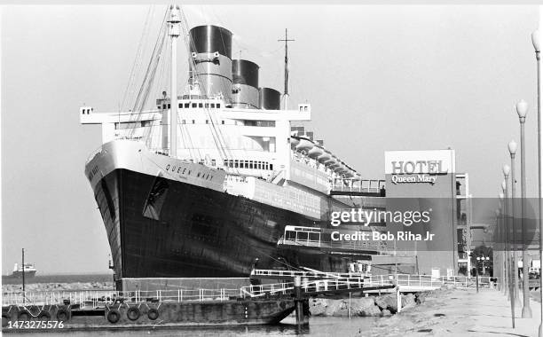Queen Mary ship is berthed alongside the World's Largest Geodesic Dome, June 8 1984 in Long Beach, California. .