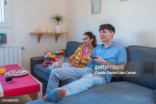 caucasian couple playing video game - casa calvet stock pictures, royalty-free photos & images