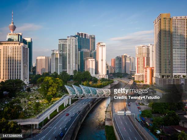 aerial view of saloma bridge linked klcc and kampung baru area - skybridge petronas twin towers stock pictures, royalty-free photos & images