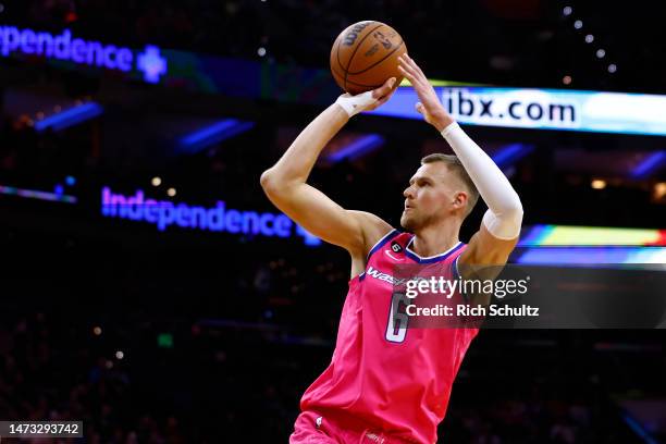 Kristaps Porzingis of the Washington Wizards in action against the Philadelphia 76ers during a game at Wells Fargo Center on March 12, 2023 in...