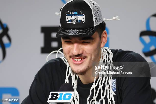 Zach Edey of the Purdue Boilermakers answers questions from the media after defeating the Penn State Nittany Lions in the Big Ten Basketball...