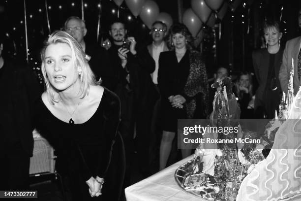 English-born American actress and award-winning star of Knot's Landing Nicollette Sheridan thanks her guests while standing next to her cake at her...