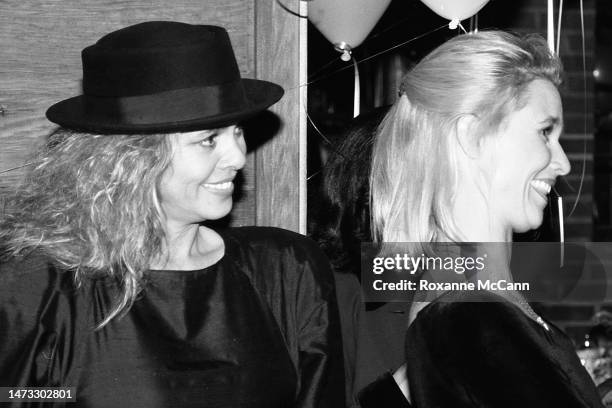 Award-winning actress Nicollette Sheridan listens to the speaker at her surprise thirtieth birthday party next to her mother actress Sally Adams...