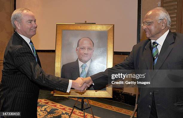 International Cricket Council President Sharad Pawar greets the new ICC President Alan Isaac during the ICC Annual Conference held at the Shangri-La...