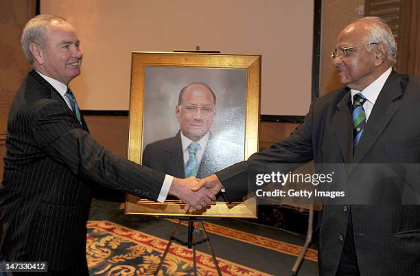 International Cricket Council President Sharad Pawar shakes greets the new ICC President Alan Isaac during the ICC Annual Conference held at the...