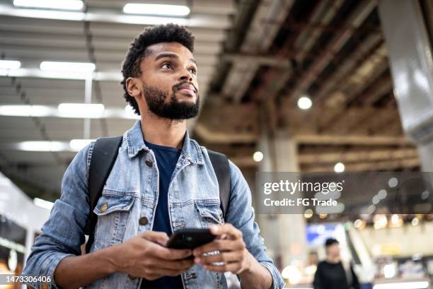 mid adult man at the airport - looking around stock pictures, royalty-free photos & images
