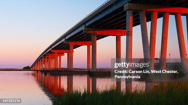 red colored lights below bridge - margate city stock pictures, royalty-free photos & images