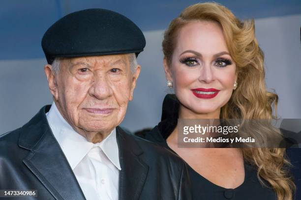 Ignacio López Tarso and Gabriela Spanic pose for pictures during the inauguration of a photographic exhibition to honor López Tarso career on August...