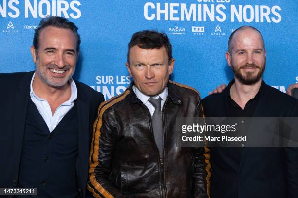 Jean Dujardin, Sylvain Tesson and Wouter Dewit attend the ""Sur Les Chemins Noirs" premiere at Cinema UGC Normandie on March 13, 2023 in Paris,...