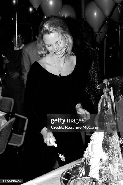 English-born American actress and award-winning star of Knot's Landing Nicollette Sheridan cuts her cake at her surprise thirtieth birthday party in...