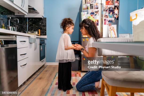 little girl being spoken to sternly at home by her mother - straff sportaktivitet bildbanksfoton och bilder