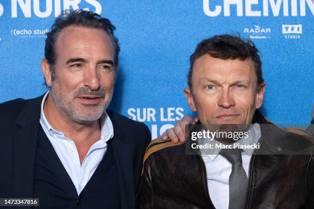 Sylvain Tesson and Jean Dujardin attend the ""Sur Les Chemins Noirs" premiere at Cinema UGC Normandie on March 13, 2023 in Paris, France.