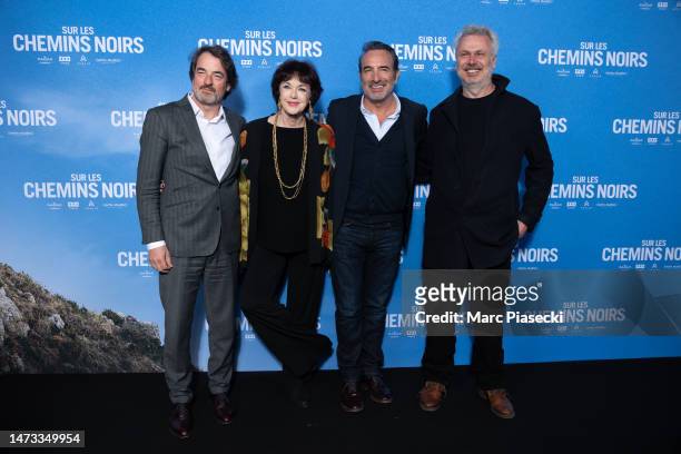 Denis Imbert, Anny Duperey, Jean Dujardin and a guest attend the "Sur Les Chemins Noirs" premiere at Cinema UGC Normandie on March 13, 2023 in Paris,...