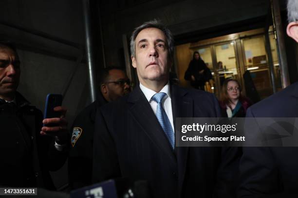 Former Donald Trump lawyer and loyalist Michael Cohen walks out of a Manhattan courthouse after testifying before a grand jury on March 13, 2023 in...