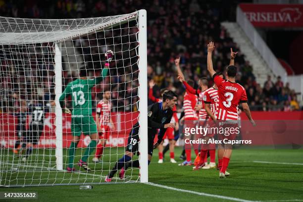 Alvaro Morata of Atletico Madrid celebrates after scoring the team's first goal whilst Girona FC players make an appeal during the LaLiga Santander...
