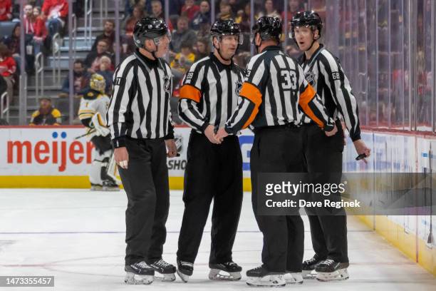 Referees Chris Lee, Kevin Pollock talk over a play with Linesmen CJ Murray and Brad Kovachik during the second period of an NHL game between the...
