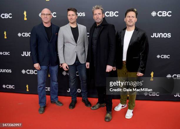 Mike Kroeger, Daniel Adair, Chad Kroeger, and Ryan Peake of Nickelback attend the 2023 JUNO Awards at Rogers Place on March 13, 2023 in Edmonton,...