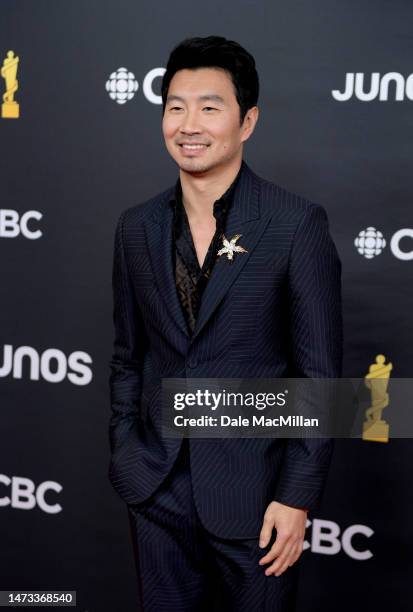 Simu Liu attends the 2023 JUNO Awards at Rogers Place on March 13, 2023 in Edmonton, Alberta.