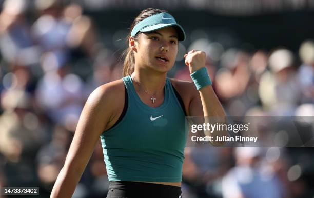 Emma Raducanu of Great Britain celebrates in her match against Beatriz Haddad Maia of Brazil during the BNP Paribas Open on March 13, 2023 in Indian...