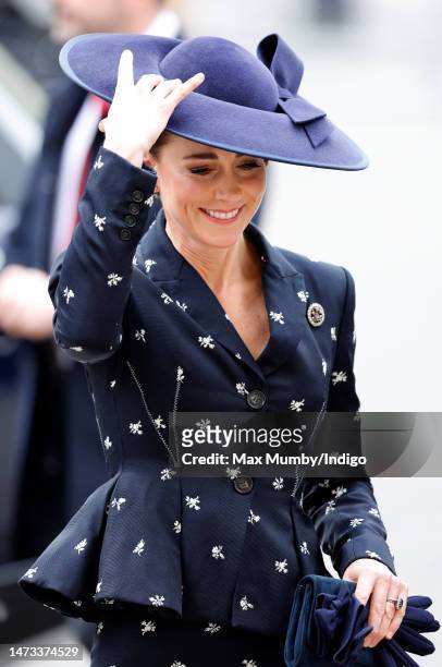 Catherine, Princess of Wales holds onto her hat in the wind as she attends the 2023 Commonwealth Day Service at Westminster Abbey on March 13, 2023...