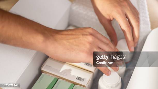 person hands searching medicine in box - pharmaceutical industry stock pictures, royalty-free photos & images