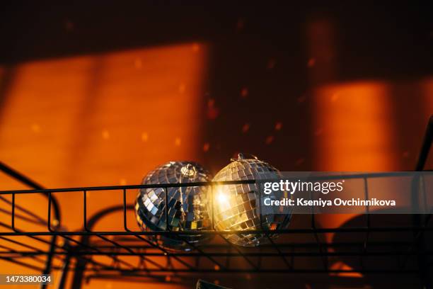 disco ball in the sun in the interior - photo shoot at home stock pictures, royalty-free photos & images