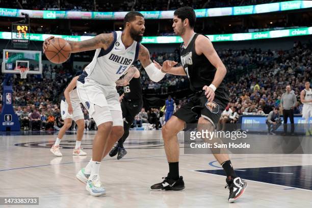 Markieff Morris of the Dallas Mavericks controls the ball as Santi Aldama of the Memphis Grizzlies defends during the first half at American Airlines...