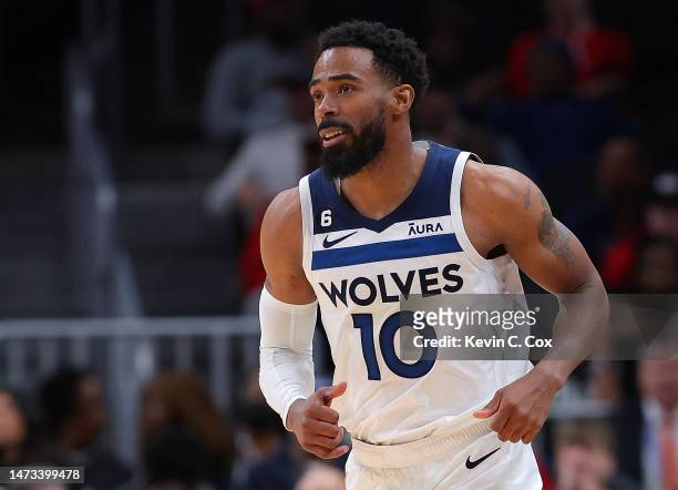 Mike Conley of the Minnesota Timberwolves reacts after hitting a three-point basket against the Atlanta Hawks during the fourth quarter at State Farm...