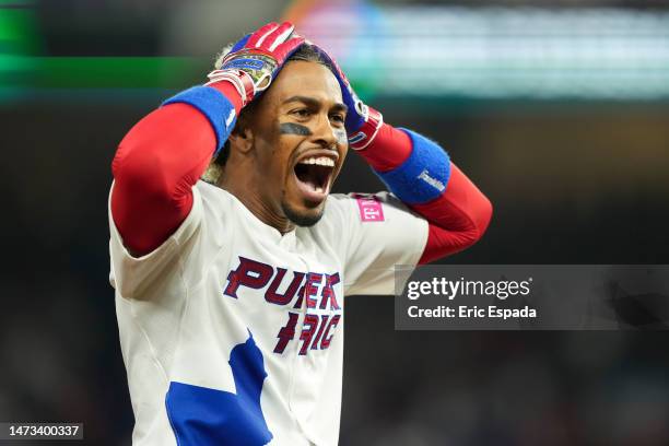 Francisco Lindor of Puerto Rico celebrates after hitting a triple in the fifth inning against Israel at loanDepot park on March 13, 2023 in Miami,...