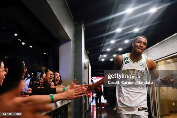 Jabari Smith Jr. #1 of the Houston Rockets slaps the hands of fans following a game against the Boston Celtics at Toyota Center on March 13, 2023 in...