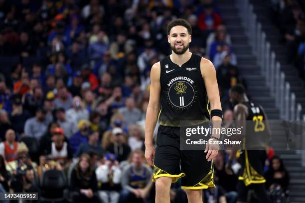 Klay Thompson of the Golden State Warriors walks down the court in the first half against the Phoenix Suns at Chase Center on March 13, 2023 in San...