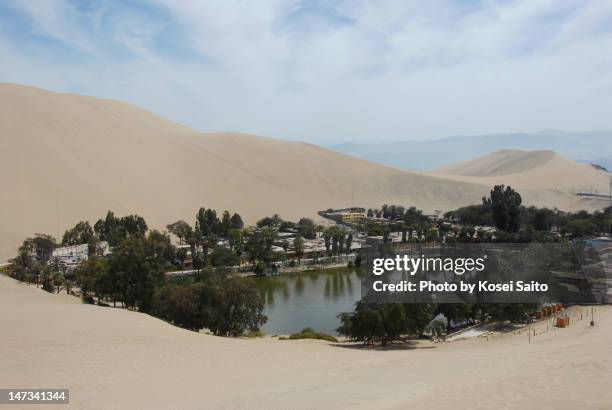 desert and lake - huacachina stock pictures, royalty-free photos & images