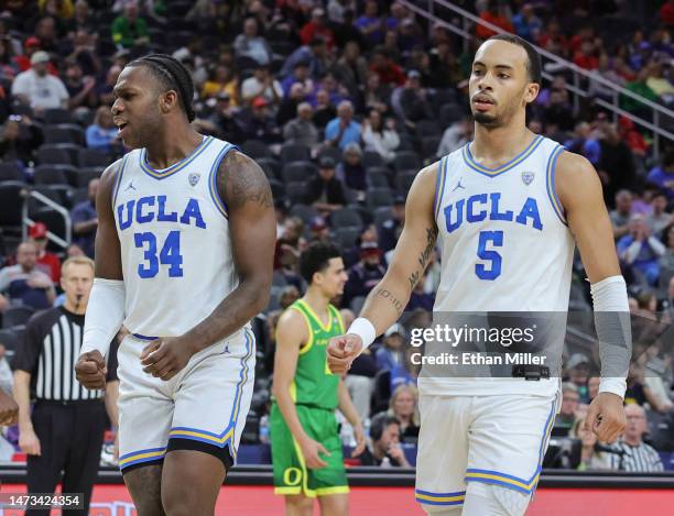 David Singleton and Amari Bailey of the UCLA Bruins react in the second half of a semifinal game of the Pac-12 basketball tournament against the...