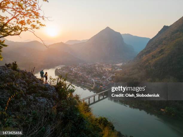 aerial view of tranquil scene of mekong river at sunset - river mekong stockfoto's en -beelden