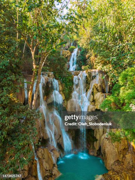 aerial view of refreshing  kuang si waterfall in the jungles - kuang si falls stock pictures, royalty-free photos & images