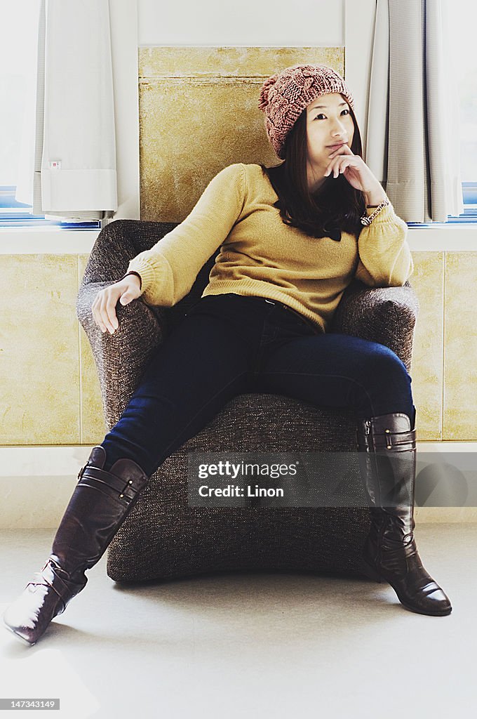 Young woman sitting on chair