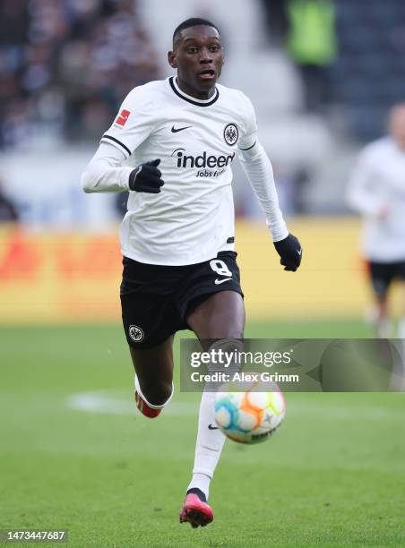 Randal Kolo Muani of Eintracht Frankfurt controls the ball during the Bundesliga match between Eintracht Frankfurt and VfB Stuttgart at Deutsche Bank...