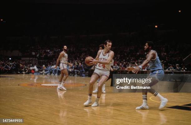 The New York Knicks' Bill Bradley pictured with the ball in a game against the Buffalo Braves at Madison Square Garden in New York on Febuary 22nd,...