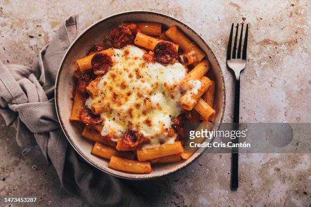 rigatoni with chorizo and bechamel - penne pasta stock pictures, royalty-free photos & images