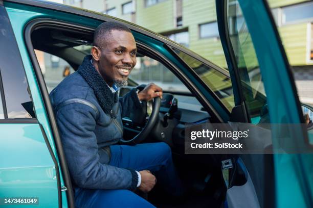 businessman arriving at office - business man driving stock pictures, royalty-free photos & images