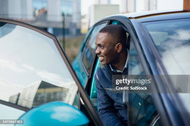 businessman starting the day with a smile - car man stock pictures, royalty-free photos & images