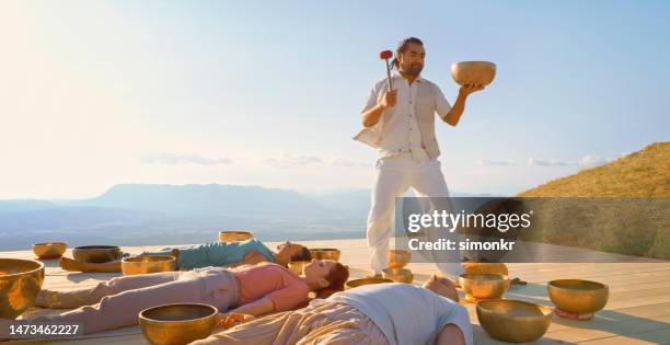 Man Ringing Gong Cloud Gong Photos and Premium High Res Pictures - Getty Images