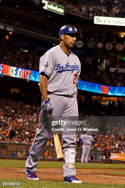 Juan Rivera of the Los Angeles Dodgers returns to the dugout after an at bat against the San Francisco Giants during the ninth inning at AT&T Park on...